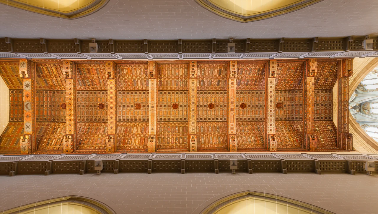 Mudéjar decorated coffer ceiling of the nave of the Teruel Cathedral, Aragon, Spain. This unique piece belongs to the UNESCO Heritage site of the Mudéjar Architecture of Aragon and dates from the 14th century. It shows historical, religious, human and animal figures in Gothic style.